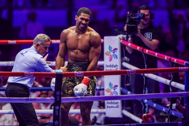 Britain's boxer Anthony Joshua celebrates winning against Albania's boxer Kristian Prenga in their heavyweight boxing fight at the Jeddah Superdome in Jeddah on July 26, 2026. Two-time heavyweight world champion Anthony Joshua survived two early knockdowns on the way to a second-round knockout of Kristian Prenga on July 26, his triumphant ring return paving the way for a blockbuster all-British bout with Tyson Fury. (Photo by AFP)