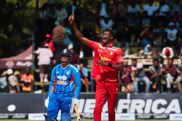 Zimbawe's Blessing Muzarabani celebrates the wicket of Abhisheck Sharma during the third Twenty20 international cricket match between Zimbabwe and India at Harare Sports Club in Harare, on July 26, 2026. (Photo by Jekesai NJIKIZANA / AFP)