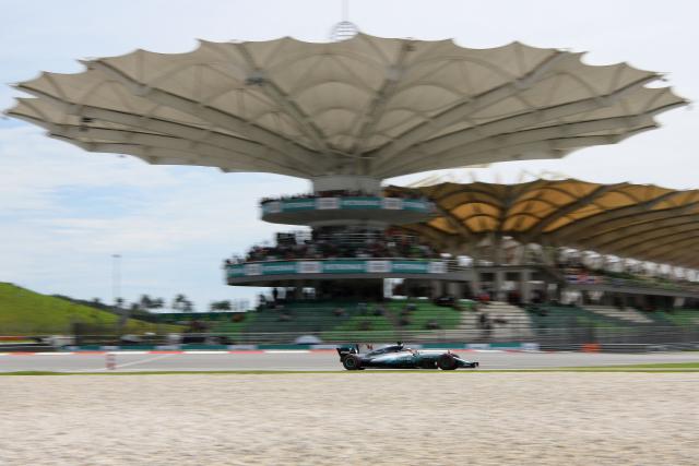 (FILES) Then Mercedes's British driver Lewis Hamilton drives his car during the third practice session of the Formula One Malaysia Grand Prix in Sepang on September 30, 2017. The Bahrain Grand Prix, which was cancelled in April due to the Middle East war, will be held in Malaysia in early October, Formula One organisers announced on July 26, 2026. "Formula 1 and the FIA can confirm that Malaysia will host the... Bahrain Grand Prix at the Sepang International Circuit from October 2-4 2026," F1 and motorsport's world governing body said in a statement. (Photo by MANAN VATSYAYANA / AFP)