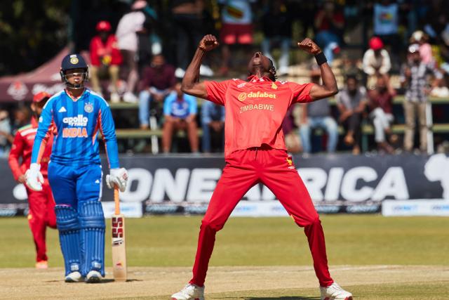 TOPSHOT - Zimbawe's Blessing Muzarabani celebrates the wicket of Abhisheck Sharma during the third Twenty20 international cricket match between Zimbabwe and India at Harare Sports Club in Harare, on July 26, 2026. (Photo by Jekesai NJIKIZANA / AFP)