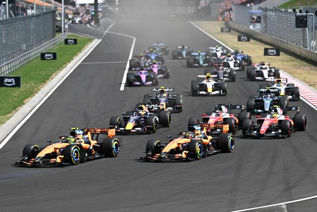 The cars are pictured at the start of the Formula One Hungarian Grand Prix at the Hungaroring racetrack in Mogyorod near Budapest, Hungary, on July 26, 2026. (Photo by Attila KISBENEDEK / AFP)