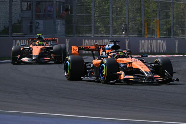 McLaren's Australian driver Oscar Piastri competes ahead of McLaren's British driver Lando Norris during the Formula One Hungarian Grand Prix at the Hungaroring racetrack in Mogyorod near Budapest, Hungary, on July 26, 2026. (Photo by Andrej ISAKOVIC / AFP)