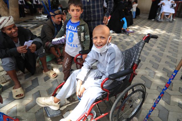 A Yemeni child suffering from cancer sits in a wheelchair as he waits to receive treatment at the National Oncology Centre in the capital Sanaa on July 26, 2026, as much of Yemen's infrastructure and healthcare system has been destroyed by the ongoing civil war that began in late 2014. (Photo by Mohammed HUWAIS / AFP)