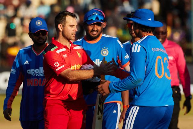 Zimbabwe's Ryan Burl (2nd L) shakes hands with India’s Vaibhav Sooryavanshi (1st R) after India's victory during the third Twenty20 international cricket match between Zimbabwe and India at Harare Sports Club in Harare, on July 26, 2026. (Photo by Jekesai NJIKIZANA / AFP)
