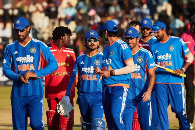 Players walk off the field after India’s victory during the third Twenty20 international cricket match between Zimbabwe and India at Harare Sports Club in Harare, on July 26, 2026. (Photo by Jekesai NJIKIZANA / AFP)