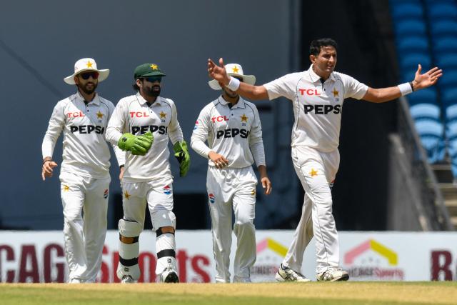 Mohammad Abbas (R), Imam-Ul-Haq (L) and Mohammad Rizwan (2L) of Pakistan celebrate the dismissal of Roston Chase of West Indies during the 2nd day of 1st Test match between West Indies and Pakistan at Brian Lara Cricket Academy in Tarouba, Trinidad and Tobago on July 26, 2026. (Photo by Randy Brooks / AFP)