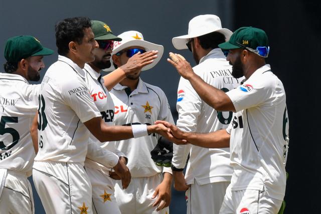 Mohammad Abbas (L) and Sajid Khan (R) of Pakistan celebrate the dismissal of Roston Chase of West Indies during the 2nd day of 1st Test match between West Indies and Pakistan at Brian Lara Cricket Academy in Tarouba, Trinidad and Tobago on July 26, 2026. (Photo by Randy Brooks / AFP)