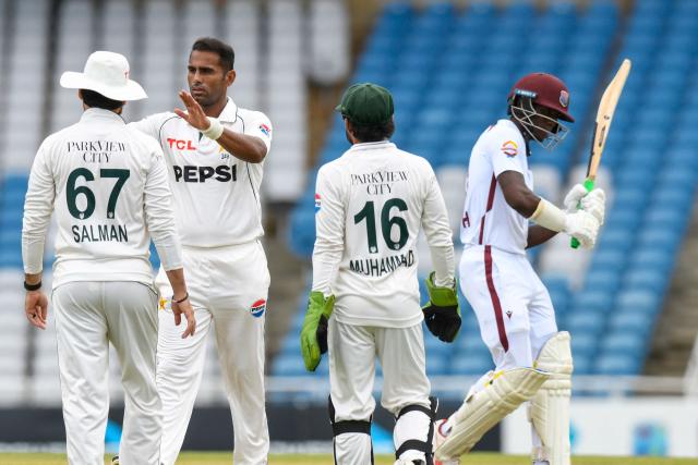 Mohammad Ali (2L) of Pakistan celebrates the dismissal of Shamar Joseph (R) of West Indies during the 2nd day of 1st Test match between West Indies and Pakistan at Brian Lara Cricket Academy in Tarouba, Trinidad and Tobago on July 26, 2026. (Photo by Randy Brooks / AFP)