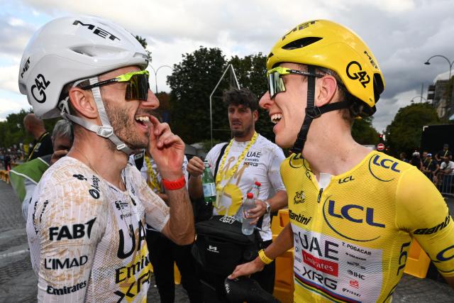 UAE Team Emirates - XRG's Slovenian rider Tadej Pogacar celebrates his overall victory with UAE Team Emirates - XRG's British rider Adam Yates after the 21st stage of the 113th edition of the Tour de France cycling race, 88,7 km starting and finishing in Paris, on July 26, 2026. (Photo by Dario Belingheri / POOL / AFP)