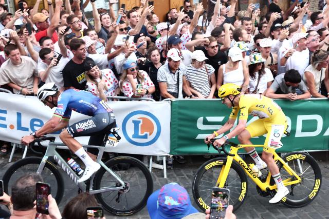 UAE Team Emirates - XRG's Slovenian rider Tadej Pogacar, wearing the overall leader yellow jersey, and Alpecin - Premier Tech team's Dutch rider Mathieu van der Poel cycle in a breakaway atop the Butte de Montmartre during the 21st stage of the 113th edition of the Tour de France cycling race, 88,7 km starting and finishing in Paris, on July 26, 2026. (Photo by Xavier GALIANA / AFP)