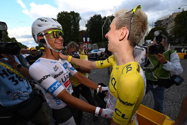 UAE Team Emirates - XRG's Slovenian rider Tadej Pogacar celebrates his overall victory with UAE Team Emirates - XRG's Mexican rider Isaac Del Toro after the 21st stage of the 113th edition of the Tour de France cycling race, 88,7 km starting and finishing in Paris, on July 26, 2026. (Photo by Dario Belingheri / POOL / AFP)