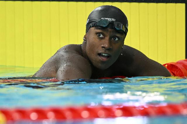 Canada's Joshua Liendo reacts after winning the Men's 100m Butterfly Final during the swimming event at the Tollcross International Swimming Centre in Glasgow, on day three of the Commonwealth Games in Glasgow, Scotland, on July 26, 2026. (Photo by Oli SCARFF / AFP)