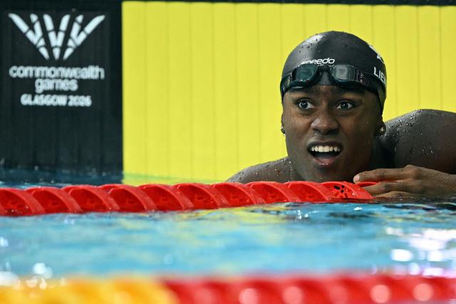 Canada's Joshua Liendo reacts after winning the Men's 100m Butterfly Final during the swimming event at the Tollcross International Swimming Centre in Glasgow, on day three of the Commonwealth Games in Glasgow, Scotland, on July 26, 2026. (Photo by Oli SCARFF / AFP)