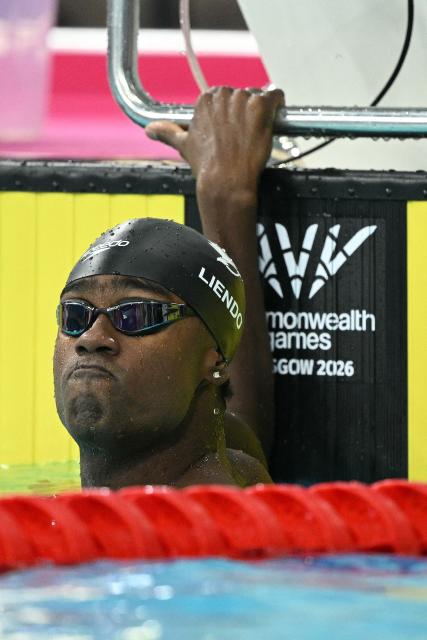 Canada's Joshua Liendo reacts after winning the Men's 100m Butterfly Final during the swimming event at the Tollcross International Swimming Centre in Glasgow, on day three of the Commonwealth Games in Glasgow, Scotland, on July 26, 2026. (Photo by Oli SCARFF / AFP)