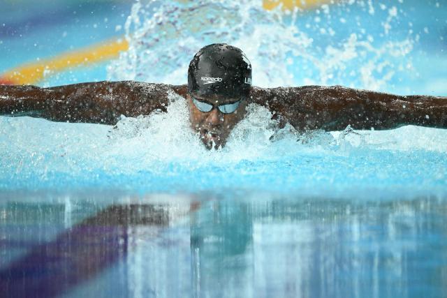 Canada's Joshua Liendo swims to win the Men's 100m Butterfly Final during the swimming event at the Tollcross International Swimming Centre in Glasgow, on day three of the Commonwealth Games in Glasgow, Scotland, on July 26, 2026. (Photo by Oli SCARFF / AFP)