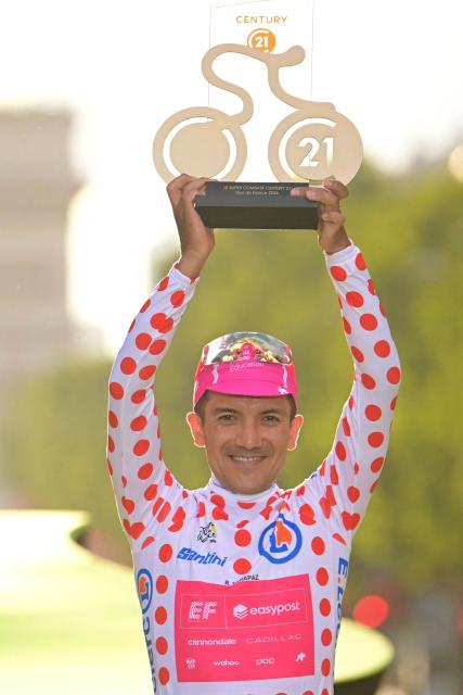 EF Education - EasyPost team's Ecuadorian rider Richard Carapaz celebrates on the podium with the most combative rider award after the 21st stage of the 113th edition of the Tour de France cycling race, 88,7 km starting and finishing in Paris, on July 26, 2026. (Photo by Bernard PAPON / POOL / AFP)