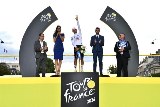 UAE Team Emirates - XRG's Mexican rider Isaac Del Toro celebrates on the podium with the best young rider's white jersey after the 21st stage of the 113th edition of the Tour de France cycling race, 88,7 km starting and finishing in Paris, on July 26, 2026. (Photo by Jeff PACHOUD / AFP)