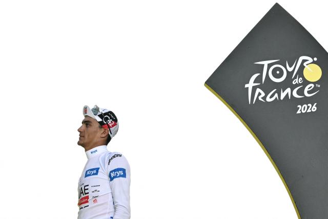 UAE Team Emirates - XRG's Mexican rider Isaac Del Toro celebrates on the podium with the best young rider's white jersey after the 21st stage of the 113th edition of the Tour de France cycling race, 88,7 km starting and finishing in Paris, on July 26, 2026. (Photo by Jeff PACHOUD / AFP)