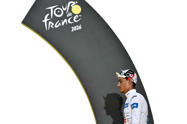 UAE Team Emirates - XRG's Mexican rider Isaac Del Toro celebrates on the podium with the best young rider's white jersey after the 21st stage of the 113th edition of the Tour de France cycling race, 88,7 km starting and finishing in Paris, on July 26, 2026. (Photo by Jeff PACHOUD / AFP)