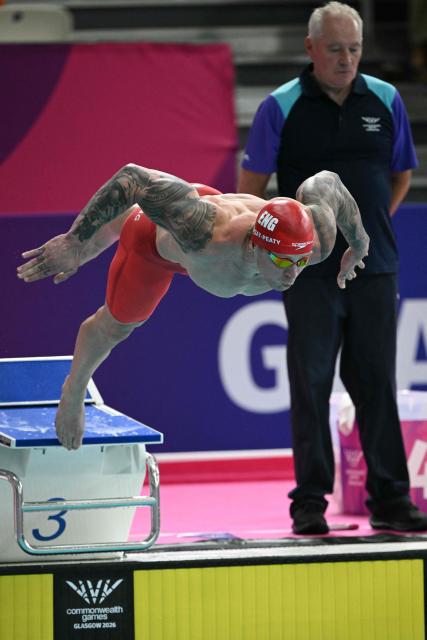 England's Adam Ramsay-Peaty dives into the pool during the Men's 50m Breaststroke Semi-Final during the swimming event at the Tollcross International Swimming Centre in Glasgow, on day three of the Commonwealth Games in Glasgow, Scotland, on July 26, 2026. (Photo by Oli SCARFF / AFP)