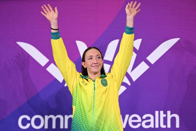 Australia's Lani Pallister celebrates with their gold medal during the medal ceremony for the Women's 1500m Freestyle at the swimming event at the Tollcross International Swimming Centre in Glasgow, on day three of the Commonwealth Games in Glasgow, Scotland, on July 26, 2026. (Photo by Oli SCARFF / AFP)