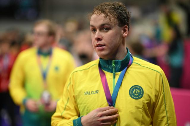 Australia's Sam Short leaves the medal ceremony for the Men's 4 x 200m Freestyle Relay at the swimming event at the Tollcross International Swimming Centre in Glasgow, on day three of the Commonwealth Games in Glasgow, Scotland, on July 26, 2026. (Photo by Oli SCARFF / AFP)