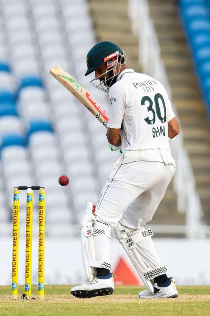 Salman Ali Agha (L) and Shan Masood (R) of Pakistan walk off the field at the end of the 2nd day of 1st Test match between West Indies and Pakistan at Brian Lara Cricket Academy in Tarouba, Trinidad and Tobago on July 26, 2026. (Photo by Randy Brooks / AFP)