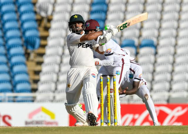 Babar Azam of Pakistan hits 4 during the 2nd day of 1st Test match between West Indies and Pakistan at Brian Lara Cricket Academy in Tarouba, Trinidad and Tobago on July 26, 2026. (Photo by Randy Brooks / AFP)