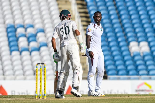 Jayden Seales (R) of West Indies after asking for the 3rd umpire review against Shan Masood (L) of Pakistan during the 2nd day of 1st Test match between West Indies and Pakistan at Brian Lara Cricket Academy in Tarouba, Trinidad and Tobago on July 26, 2026. (Photo by Randy Brooks / AFP)