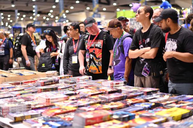 Attendees browse for Marvel items inside the convention center during Comic-Con International in San Diego, California, on July 26, 2026. (Photo by Chris DELMAS / AFP)