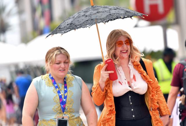 A cosplayer walks outside the convention center during Comic-Con International in San Diego, California, on July 26, 2026. (Photo by Chris DELMAS / AFP)
