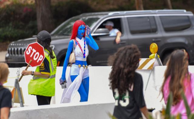 A Mystique cosplayer walks outside the convention center during Comic-Con International in San Diego, California, on July 26, 2026. (Photo by Chris DELMAS / AFP)