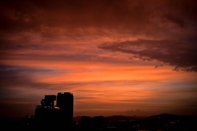 The sunset is pictured in Panama City on July 26, 2026. (Photo by MARTIN BERNETTI / AFP)