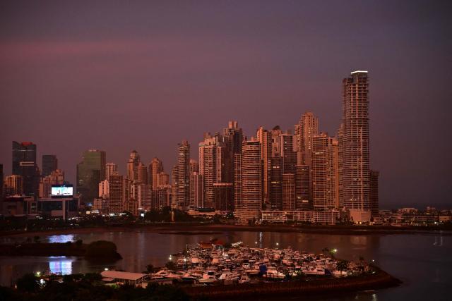 View of the skyline during the sunset in Panama City on July 26, 2026. (Photo by MARTIN BERNETTI / AFP)