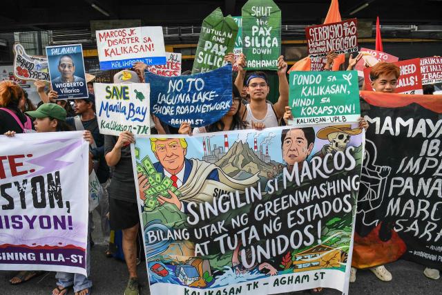 Protesters carrying placards march during a demonstration ahead of Philippine President Ferdinand Marcos’ State of the Nation Address at the House of Representatives in Quezon City, suburban Manila on July 27, 2026. (Photo by TED ALJIBE / AFP)
