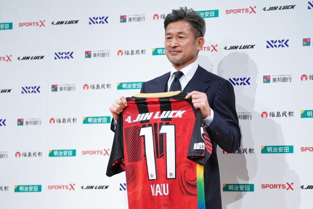 (FILES) Japanese footballer Kazuyoshi Miura, 58, shows his Fukushima United FC uniform during a press conference in Tokyo on January 9, 2026. The 59-year-old former Japan striker Kazuyoshi Miura scored his first competitive goal in almost four years when his Fukushima United side strolled to a 7-0 win on July 25, 2026. (Photo by Kazuhiro NOGI / AFP)