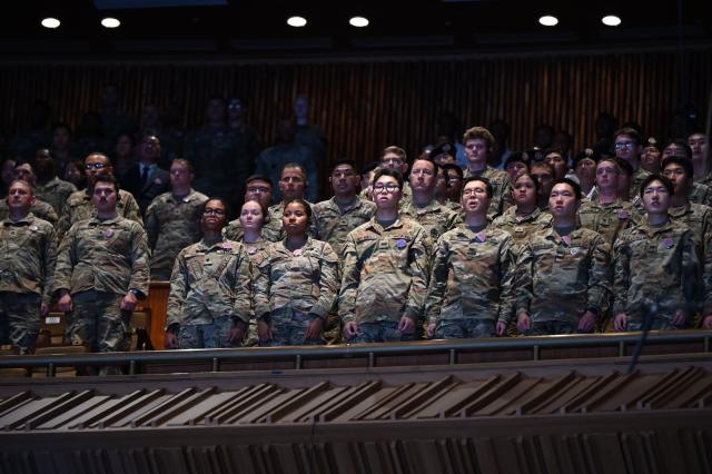 South Korean soldiers (R) sing their national anthem as they stand with US soldiers during a national ceremony for the Korean War UN Veterans Day in Seoul on July 27, 2026. (Photo by GREG BAKER / AFP)