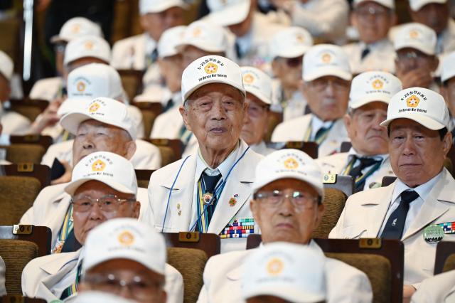 South Korean veterans of the Korean War attend a national ceremony for the Korean War UN Veterans Day in Seoul on July 27, 2026. (Photo by GREG BAKER / AFP)