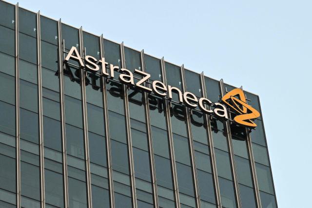 (FILES) This general view shows AstraZeneca signage on a building in Shanghai on September 5, 2024. British pharmaceutical giant AstraZeneca on July 27, 2026 said net profit rose in its second quarter, driven once again by strong growth in sales of its cancer drugs. (Photo by Hector RETAMAL / AFP)