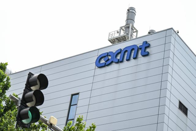 This photo shows a view of the ChangXin Memory Technologies (CXMT) factory on the outskirts of Beijing on July 27, 2026. China's leading memory chipmaker soared 470 percent in its market debut in Shanghai on July 27, 2026, briefly surpassing megabank ICBC as the mainland's most valuable company. (Photo by Pedro PARDO / AFP)