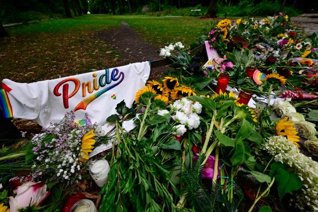 Flowers and candles have been placed in tribute to the victims at the Tiergarten park in Berlin on July 27, 2026, two days after a car ramming attack that killed one person and injured 29 near the Christopher Street Day (CSD) parade. German police announced on July 26, 2026 that they had shot and killed the chief suspect in what officials described as a deadly Islamist attack near the Berlin Pride parade the night prior, the latest ramming assault to hit the country. The attack late on July 25 -- the first such incident to target the German capital's LGBTQ community, killed one woman and wounded 29 others. (Photo by John MACDOUGALL / AFP)