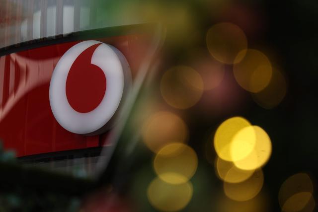 This logo for British telecommunications group Vodafone is pictured outside a shop in central London on July 27, 2026. Vodafone announced on July 27 a nearly 10 percent increase in revenue for the first quarter and raised its forecasts. (Photo by Adrian Dennis / AFP)