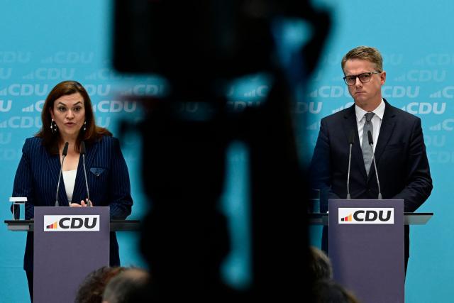 Outgoing CDU treasurer and designated CDU Secretary General Franziska Hoppermann (L) and outgoing Secretary General and designated German Health Minister Carsten Linnemann address a press conference on changes in the German government and within the party, in Berlin on July 27, 2026. (Photo by John MACDOUGALL / AFP)