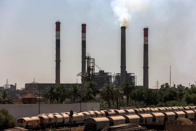 The Dora (Daura) Thermal Power Station in the Dora district of southern Baghdad is pictured on July 27, 2026. In oil-rich Iraq, many households have just a few hours of state electricity per day, and those who can afford it use private generators to keep fridges and air conditioners running. The country is the second-largest oil producer in the OPEC cartel, but despite its immense oil and gas reserves, it remains dependent on imports to meet its electricity needs. (Photo by AHMAD AL-RUBAYE / AFP)