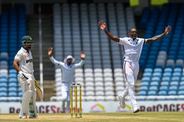 Justin Greaves (R) of West Indies celebrates the dismissal of Ali Usman (L) of Pakistan during the third day of the first Test cricket match between West Indies and Pakistan at the Brian Lara Cricket Academy in Tarouba, Trinidad and Tobago, on July 27, 2026. (Photo by Randy Brooks / AFP)