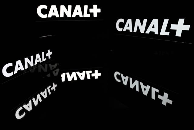 (FILES) This illustration photograph shows screens displaying the logo of the French private television channel Canal Plus (Canal+) in Toulouse, south-western France, on May 18, 2026. The Canal+ Group will invest nearly one billion euros between 2028 and 2032 in French and European cinema, its chief executive Maxime Saada announced on July 27, 2026 on the social media platform X, following an agreement with industry organisations. (Photo by Lionel BONAVENTURE / AFP)