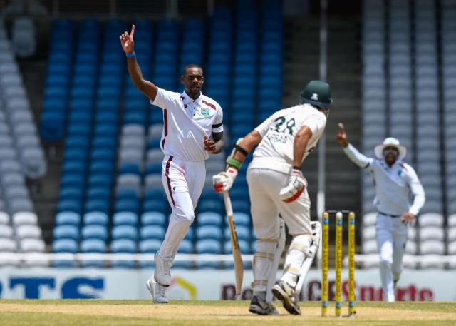 Justin Greaves (L) of West Indies celebrates the dismissal of Mohammad Abbas (R) of Pakistan during the third day of the first Test cricket match between West Indies and Pakistan at the Brian Lara Cricket Academy in Tarouba, Trinidad and Tobago, on July 27, 2026. (Photo by Randy Brooks / AFP)