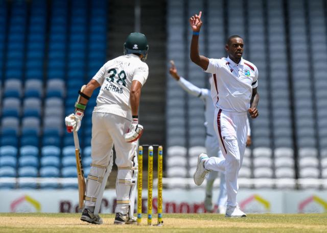 Justin Greaves (R) of West Indies celebrates the dismissal of Mohammad Abbas (L) of Pakistan during the third day of the first Test cricket match between West Indies and Pakistan at the Brian Lara Cricket Academy in Tarouba, Trinidad and Tobago, on July 27, 2026. (Photo by Randy Brooks / AFP)
