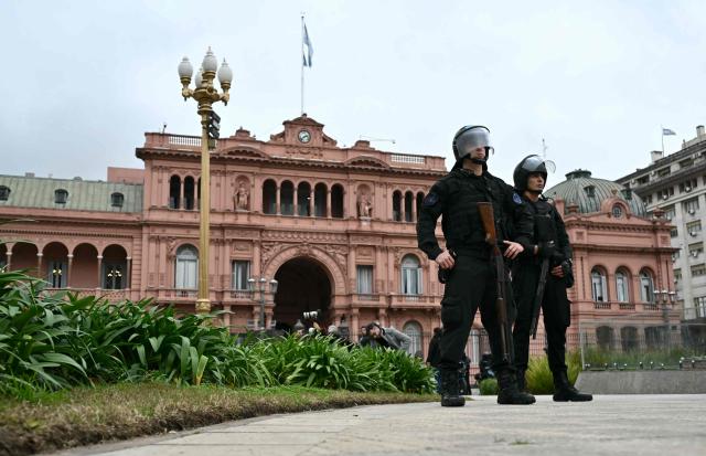 Police officers stand guard next to Casa Rosada presidential palace as International Monetary Fund (IMF) Managing Director Kristalina Georgieva meets with Argentina's President Javier Milei in Buenos Aires on July 27, 2026. (Photo by Luis ROBAYO / AFP)