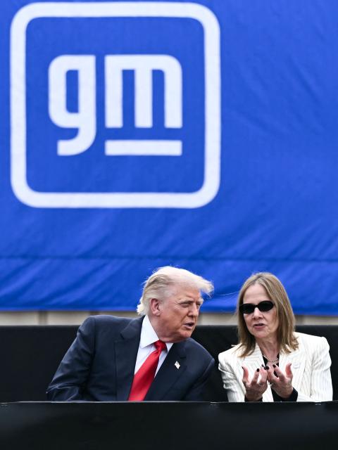 US President Donald Trump speaks with GM CEO Mary Barra as they watch a vehicle demonstration at General Motors' Milford Proving Ground in Milford, Michigan, on July 27, 2026. (Photo by Brendan SMIALOWSKI / AFP)